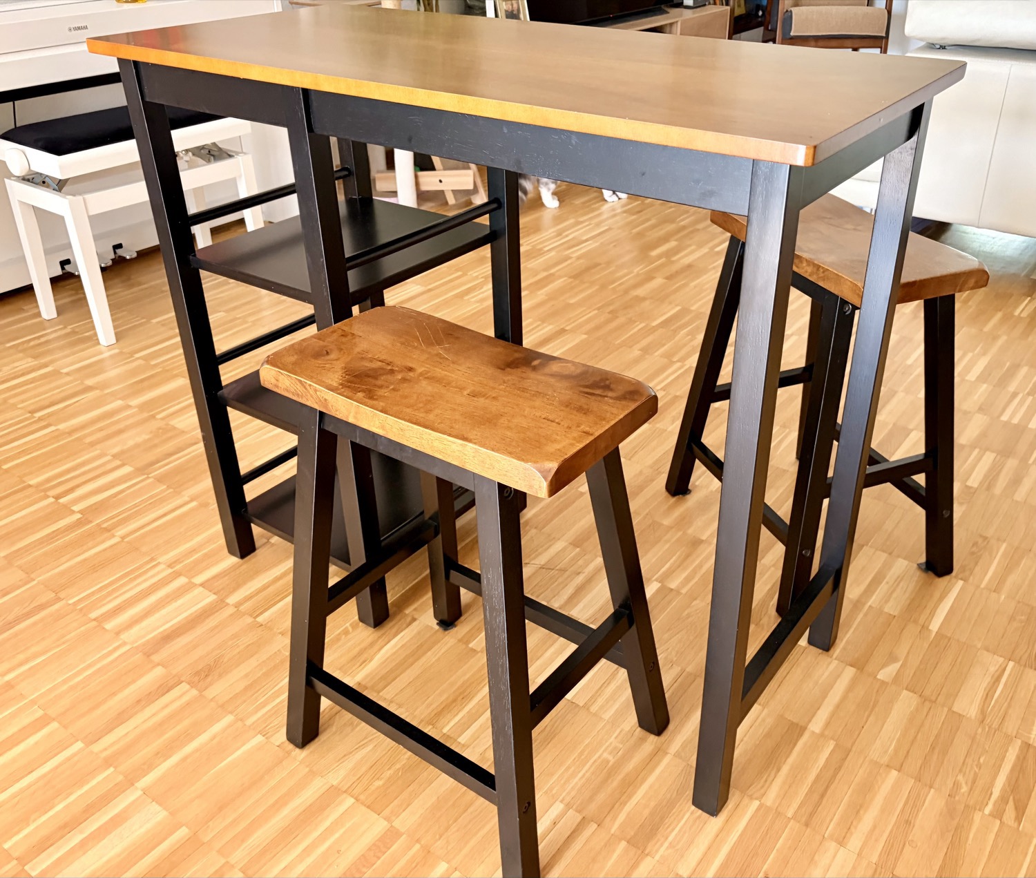 Bar table with two stools front view